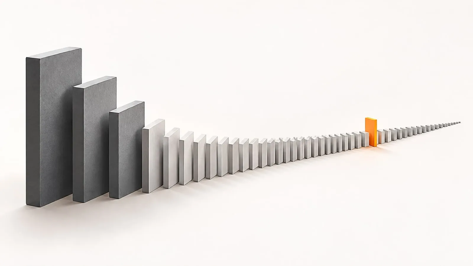 A long row of gray blocks shrinking from tall to tiny across a white surface, with one small orange block standing out far down the tail